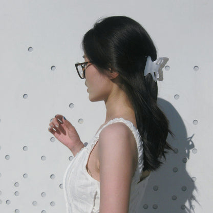 girl-in-butterfly-hair-claw-clip-in-pearl-halfup-hairstyle