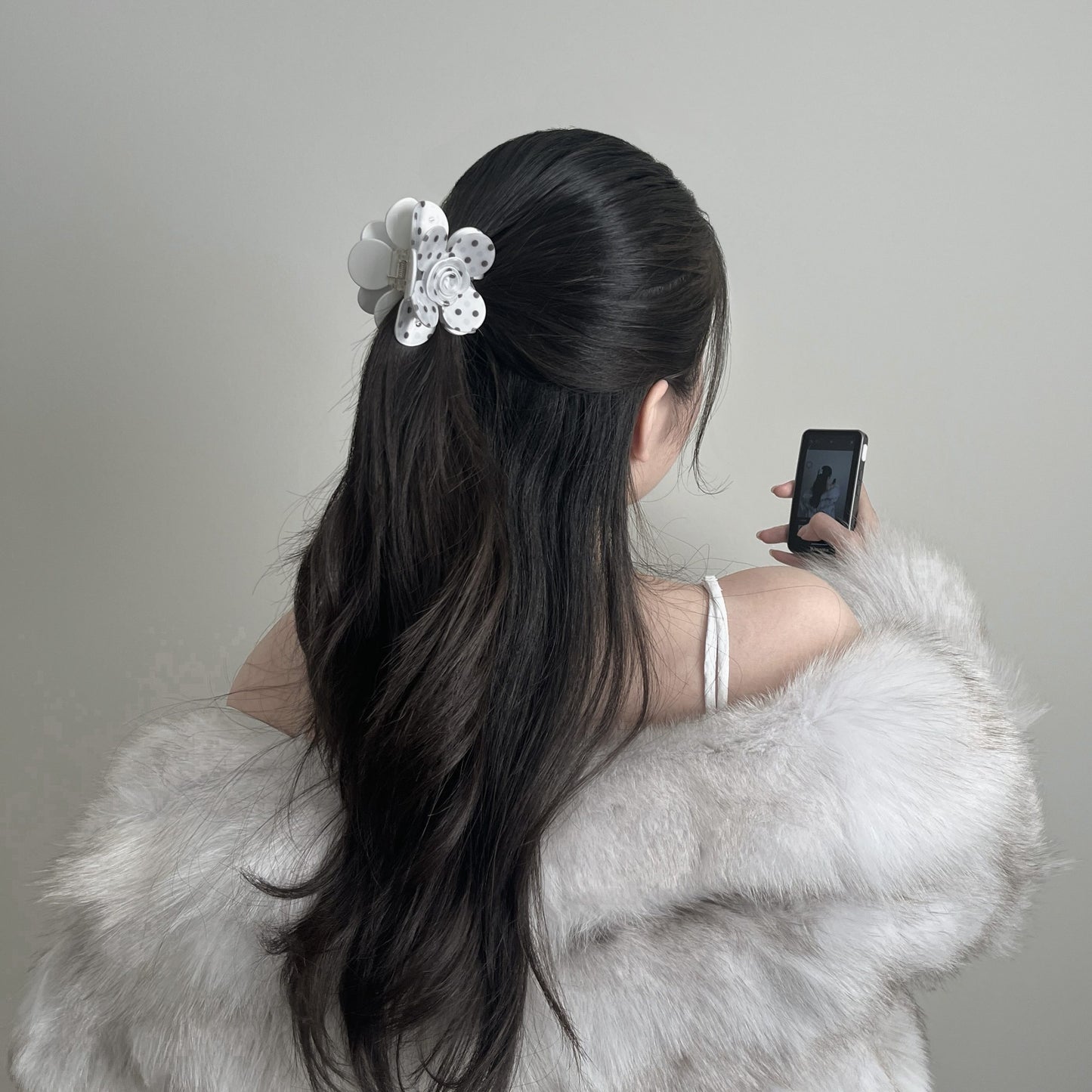 girl-in-polka-dot-flower-claw-clip-halfup-hairstyle