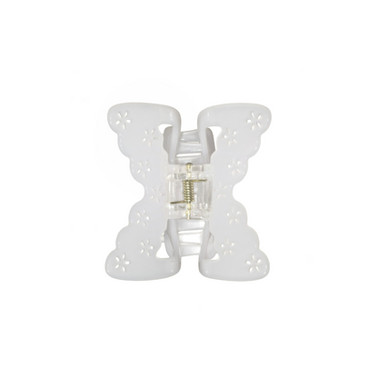 White butterfly-shaped hair claw clip on a white background