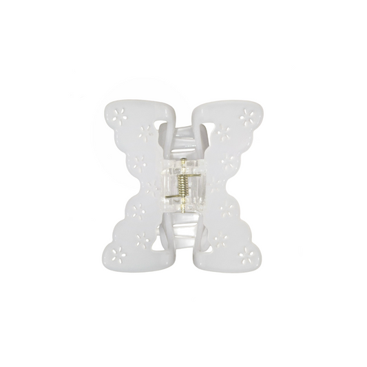 White butterfly-shaped hair claw clip on a white background