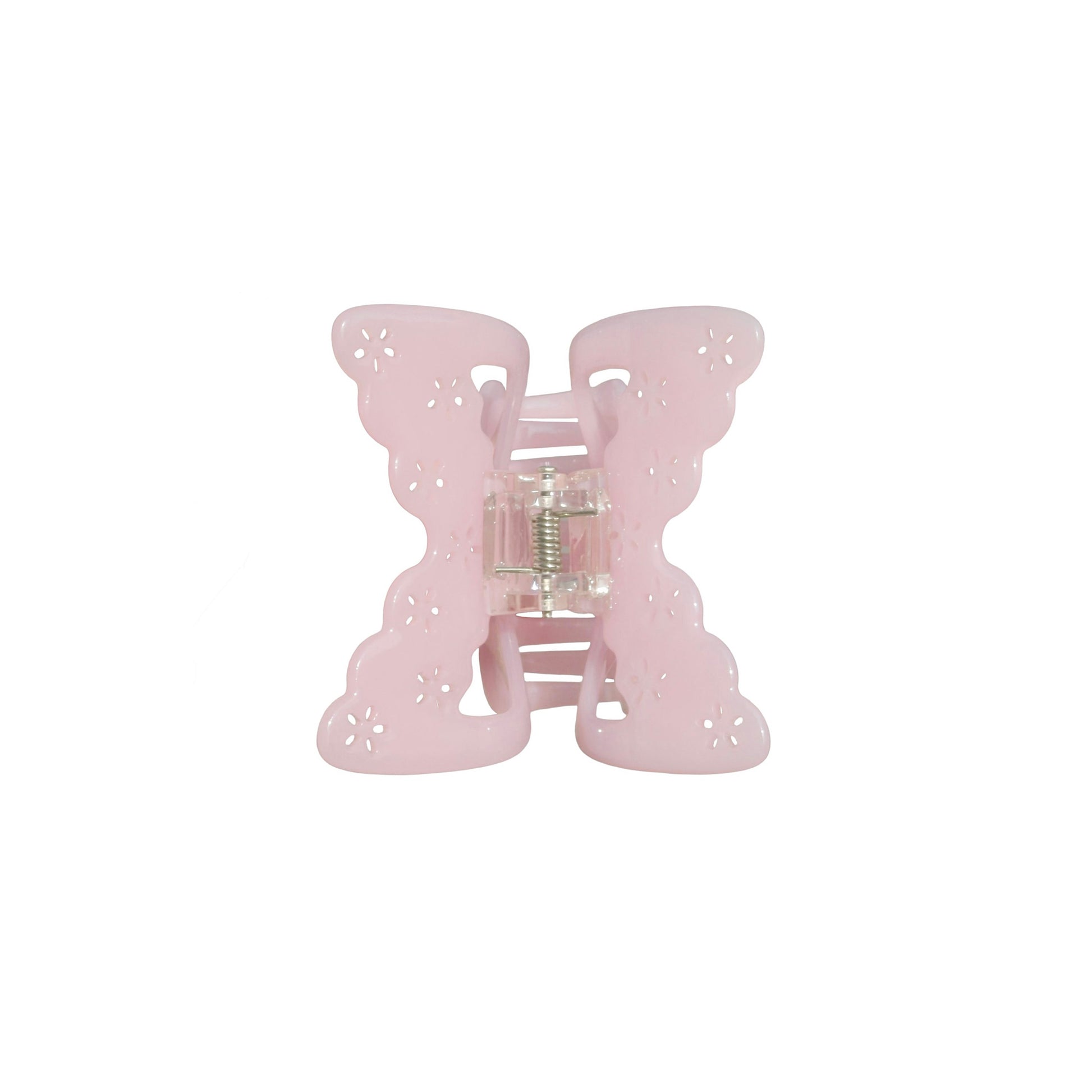 Pink butterfly-shaped hair claw clip on a white background