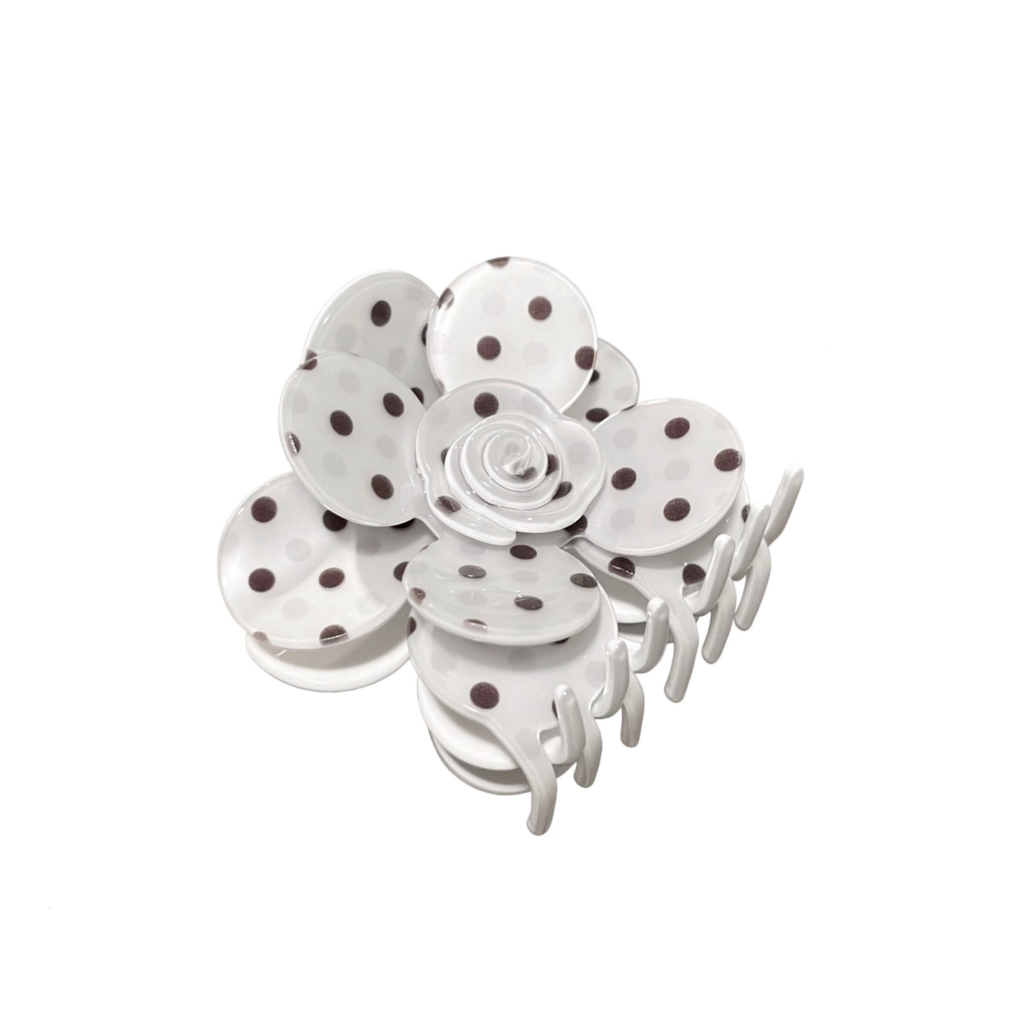 White flower hair claw clip with polka dot design on a white background